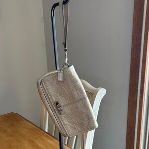 Coach champagne metallic clutch.